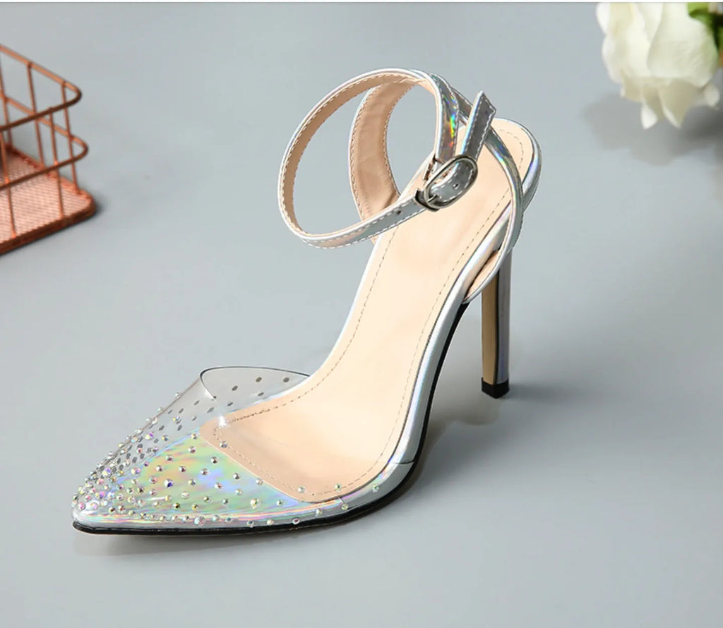 Silver glitter pointed-toe women's sandals with stiletto heels and diamond detailing.
