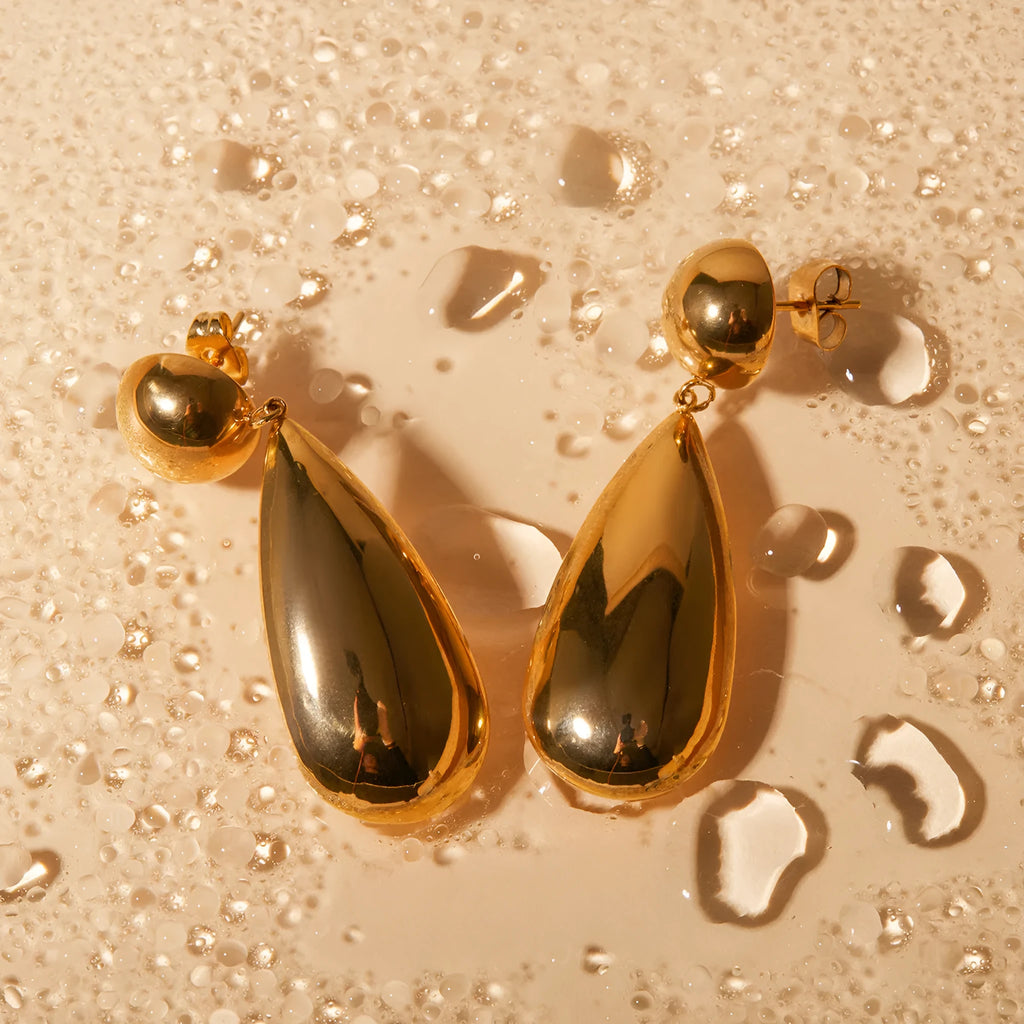 Gold-coloured stainless steel water drop pendant earrings with geometric hemisphere design