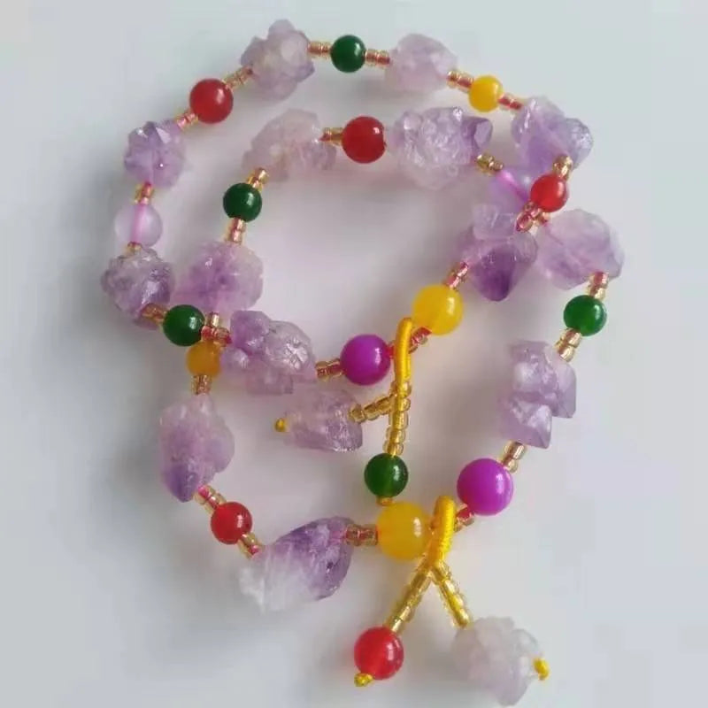 Natural shaped purple amethyst gemstone bracelet with a carved Fu character charm.