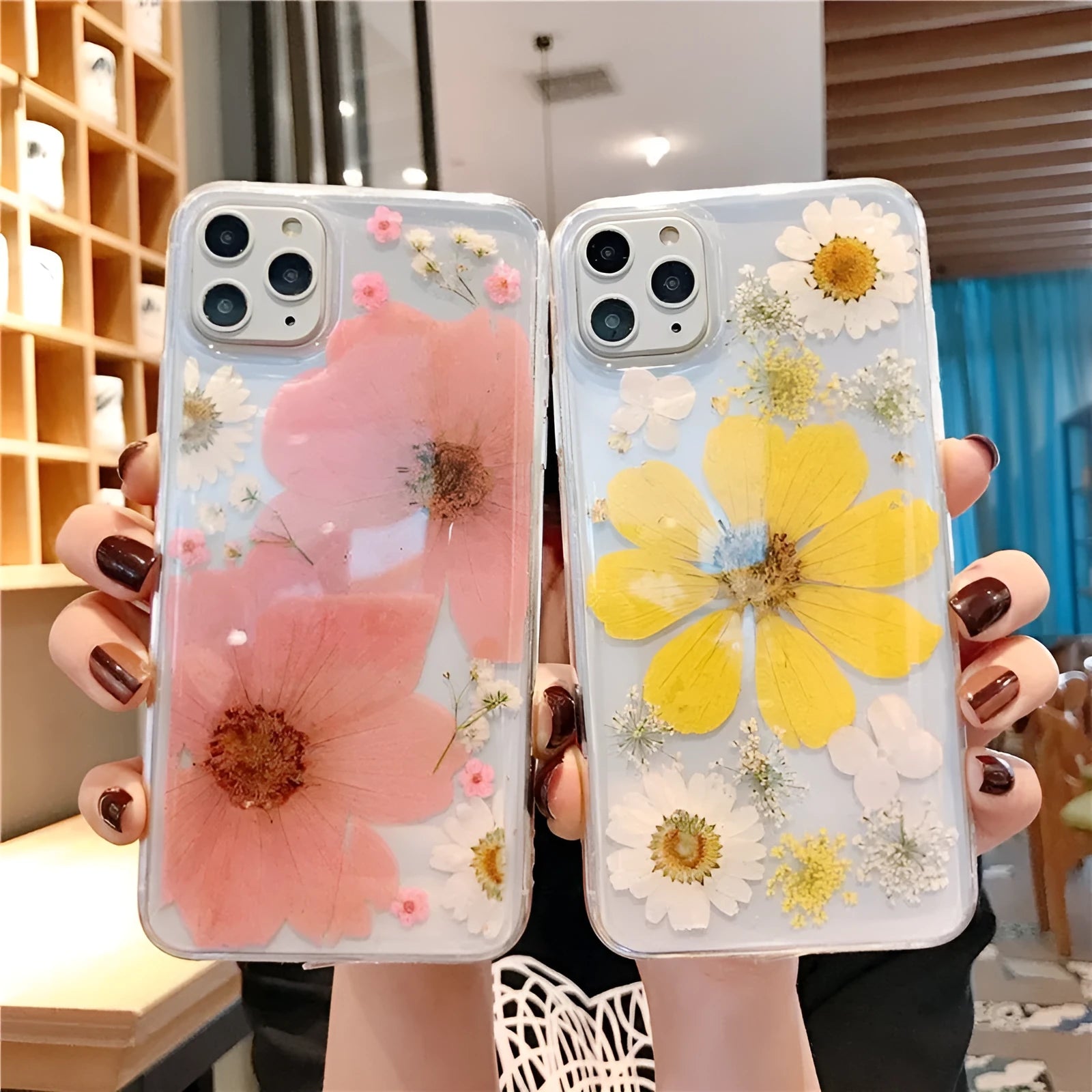 Floral patterned TPU phone case for iPhone in pink and yellow flower designs.