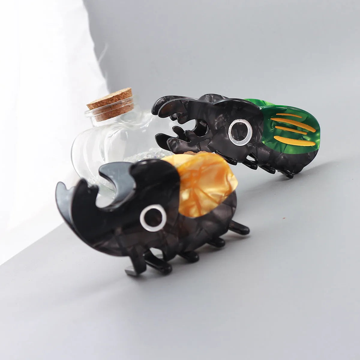 Handmade cellulose acetate beetle grip in green colour with cartoon design