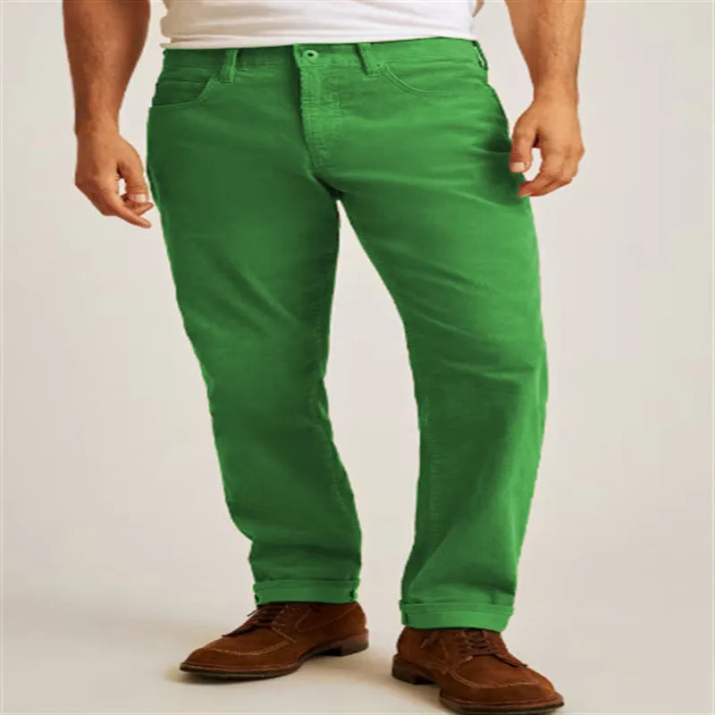 Straight leg corduroy trousers in army green colour, showing loose fit and zip fly detail.