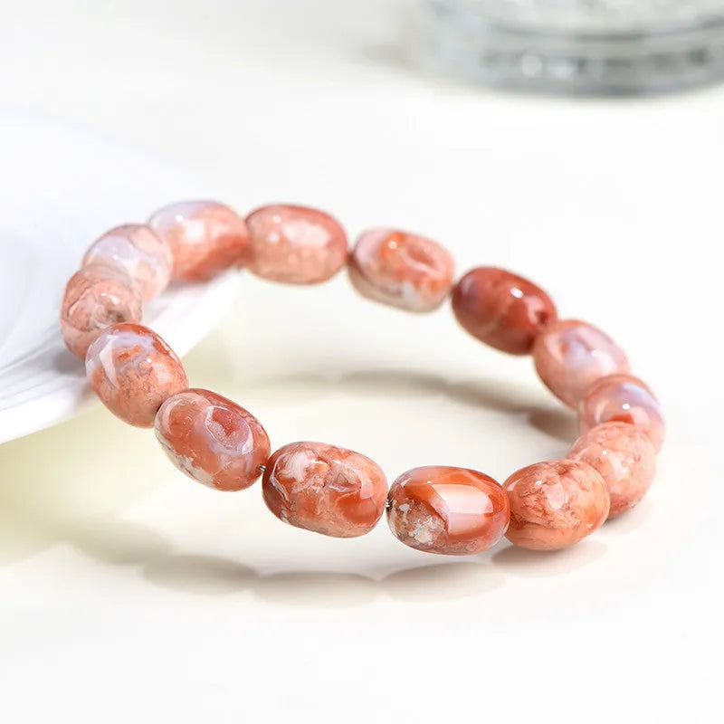 Natural cherry agate bracelet with 10x14mm barrel beads and Ruyi decorative elements