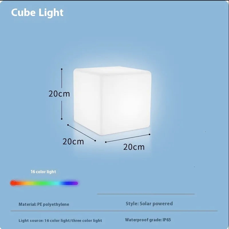Modern square white LED cube light stool outdoors on a patio.