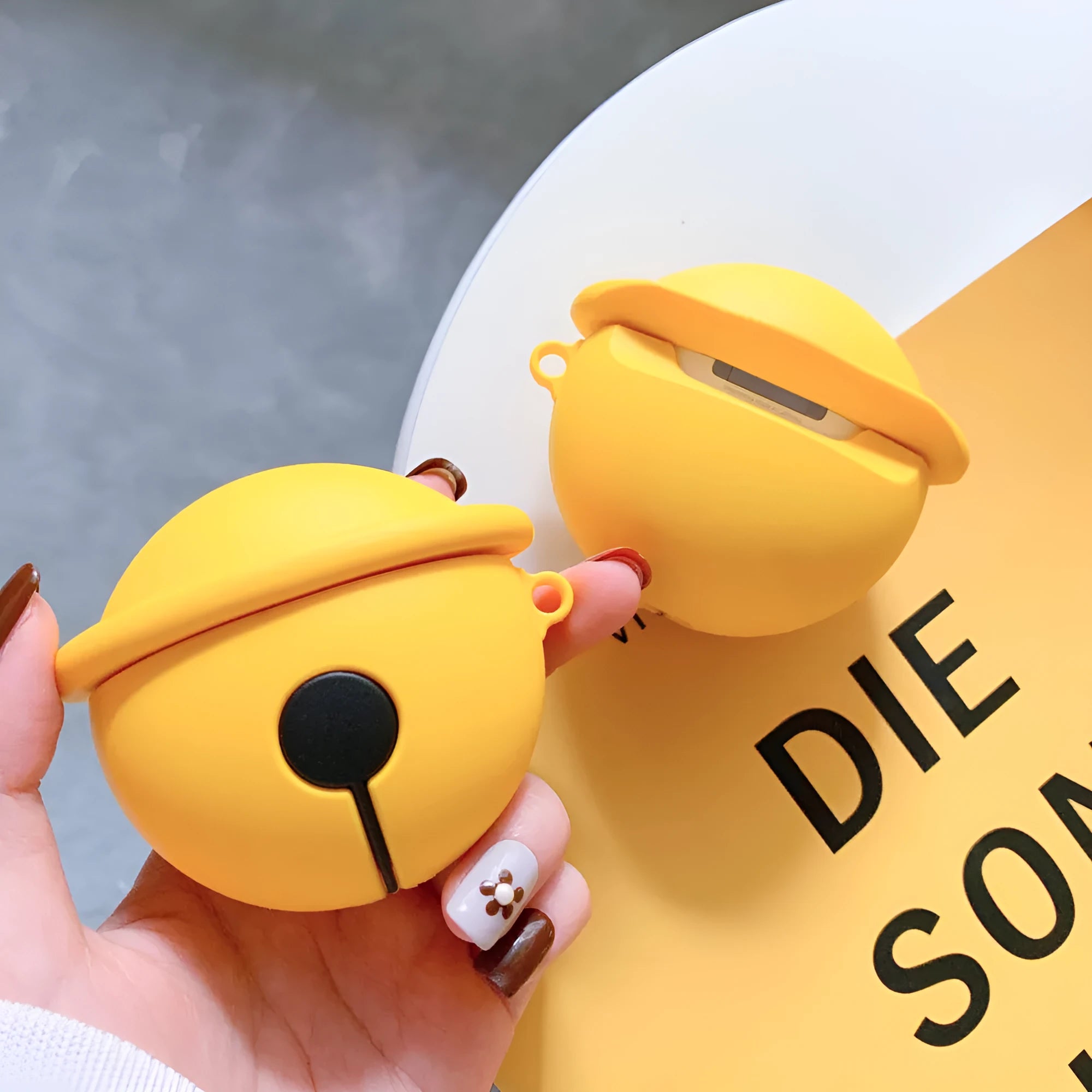 Yellow silicone protective case for AirPods 1st and 2nd generation with bell decoration