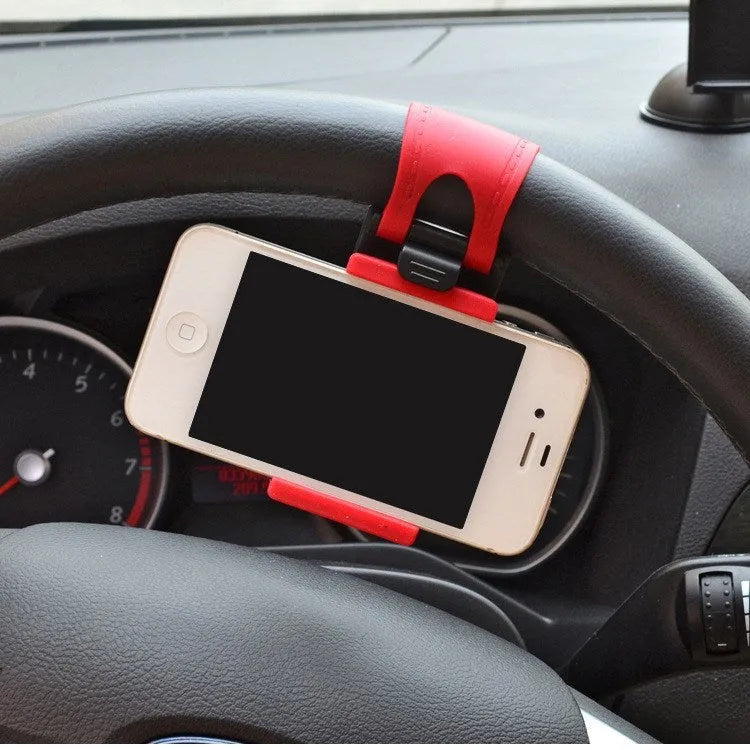 Black steering wheel phone clip holder mounted on car steering wheel