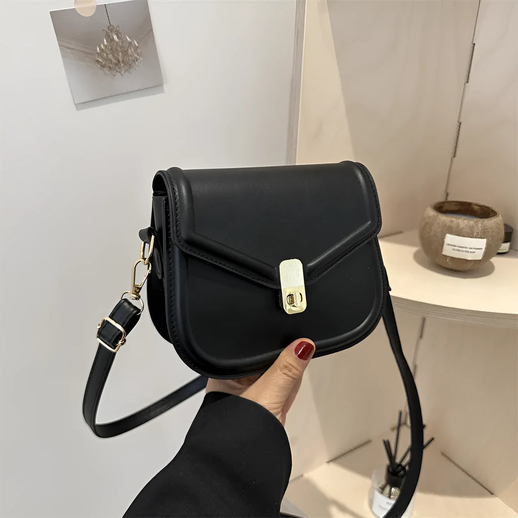 Soft PU leather clamshell shoulder messenger bag in horizontal square shape.