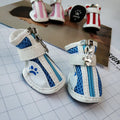 Blue VIP Teddy Schnauzer zipper closure dog shoes with non-slip sole, shown from the side.