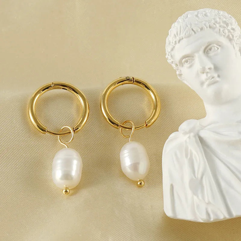 Gold-coloured geometric drop earrings with pearl accents on stainless steel for women