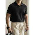 Blue cotton blend polo shirt with short sleeves displayed front view