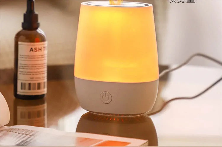 White USB aromatherapy diffuser with simulated flame effect showing mist emission