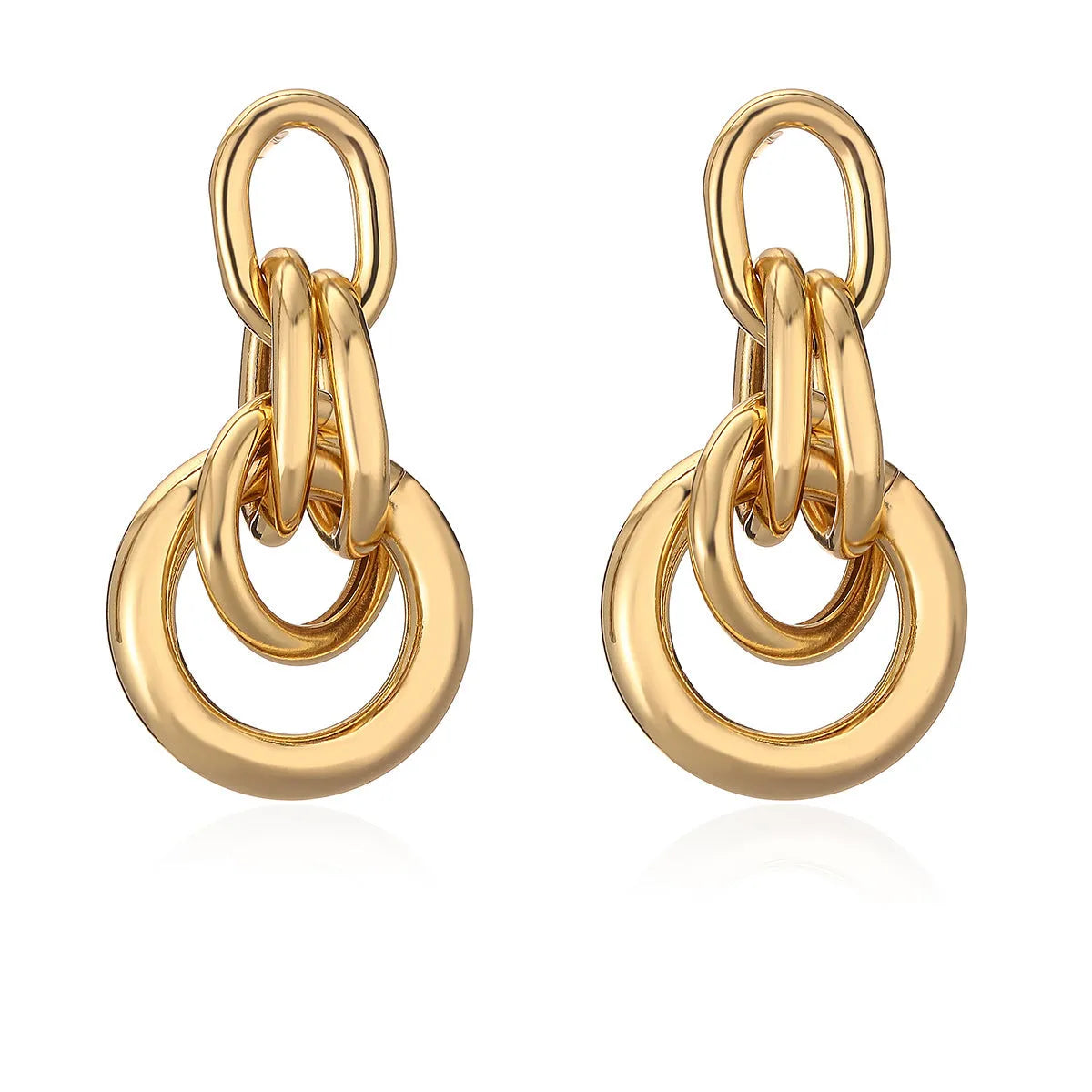 A pair of irregular geometric stud earrings in gold colour, made from copper.