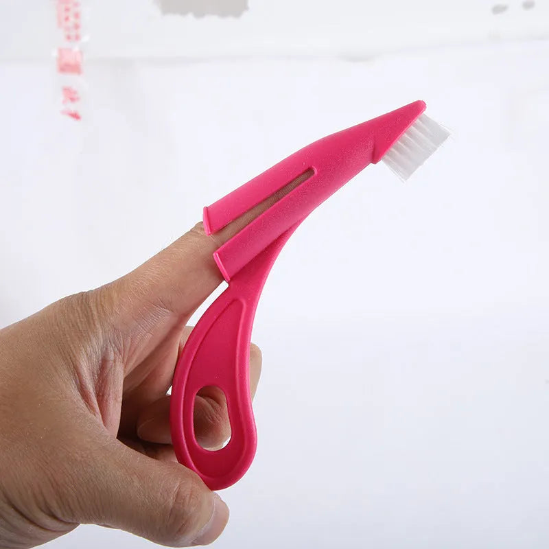 Red and white finger sleeve toothbrush for pet dental cleaning with soft silicone bristles