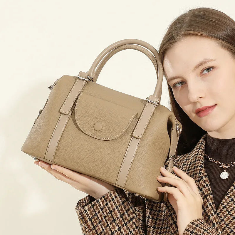 Genuine leather ladies handbag in street trend style with stitching and lock detail