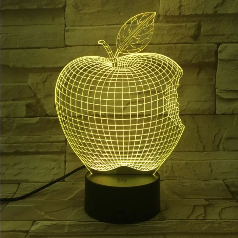 3D fruit-shaped night light with colourful LED glow and touch controls on a table.