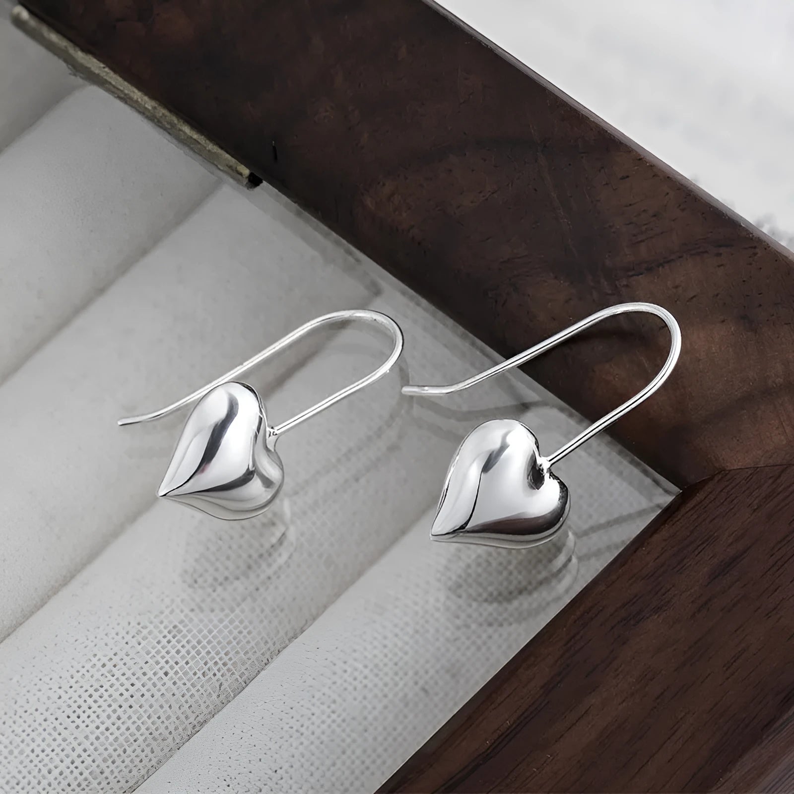 Three-dimensional glossy heart earrings with Korean style silver tone finish