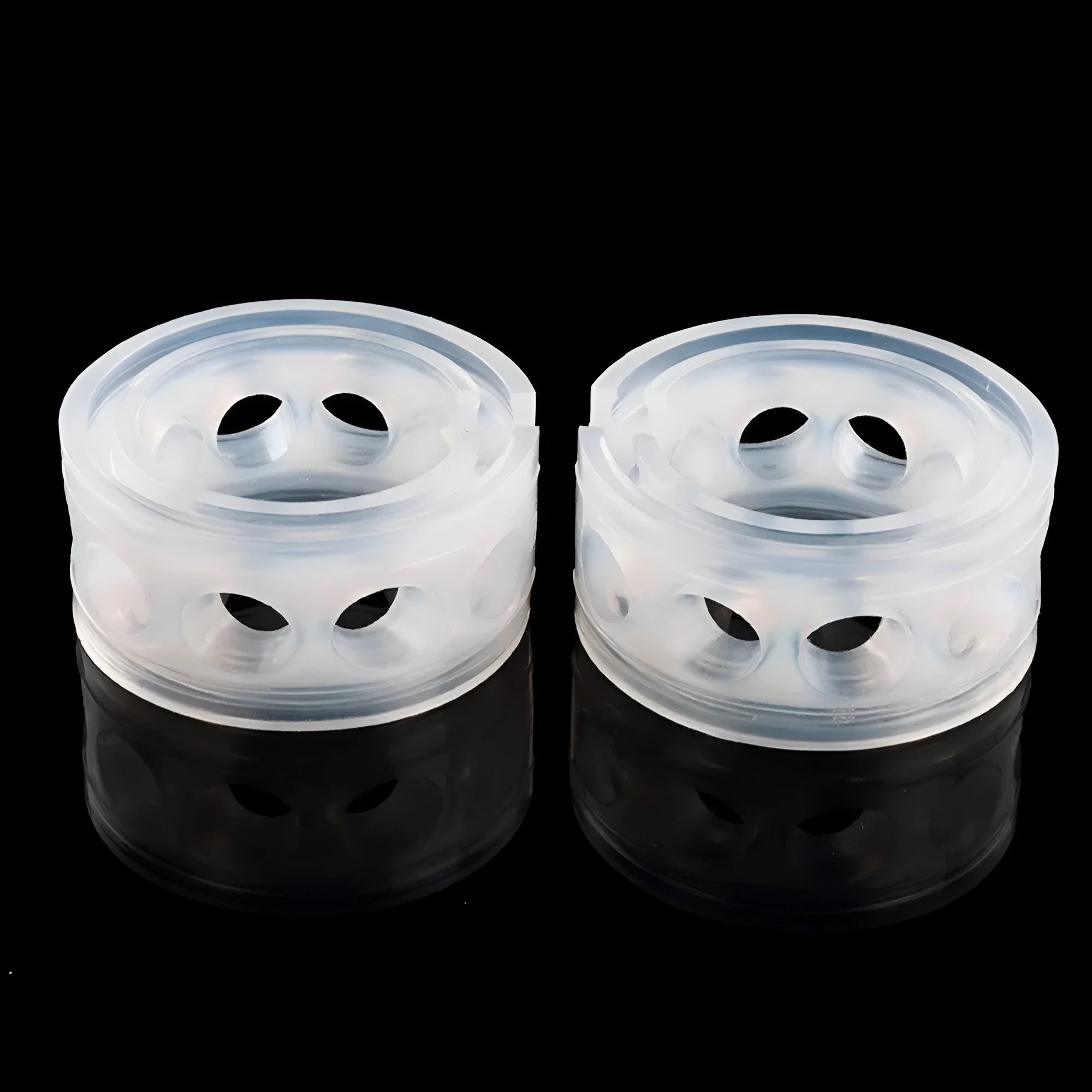 Transparent rubber shock absorber buffer for car suspension springs, shown in multiple sizes.