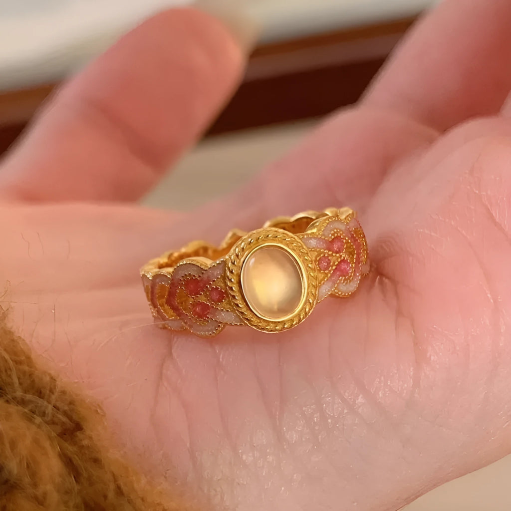 Women's open mouth ring with geometric shape, gold plating, and pink crystal enamel accents