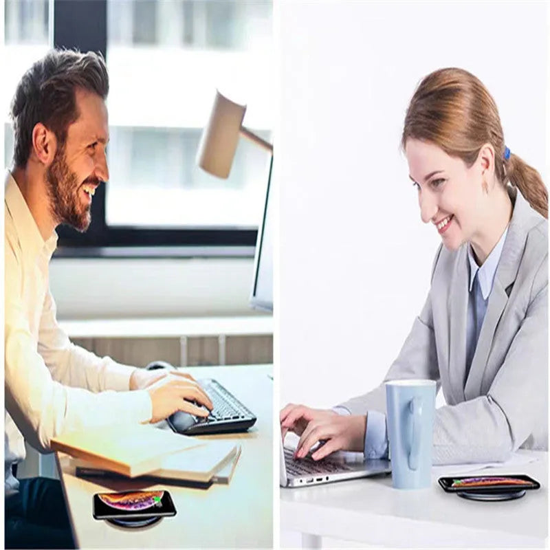 Black 15W Qi wireless charging pad on a wooden surface showing blue LED charging light