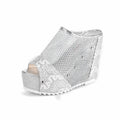 Black platform flip-flops with a chunky heel, hollowed-out design, and mesh upper on a white background.