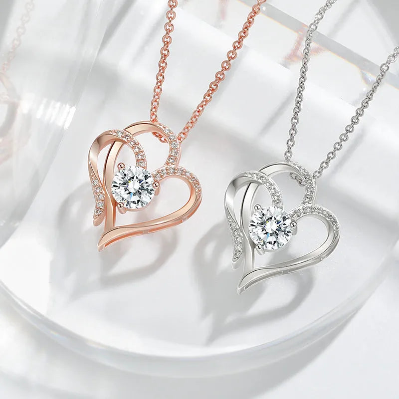 Women's sterling silver necklace with a heart-shaped pendant in rose gold, white gold, or yellow gold finish.