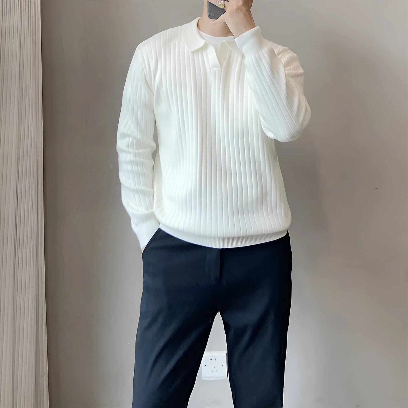Man wearing a loose fit striped lapel pullover sweater in a rabbit fur and modal blend.