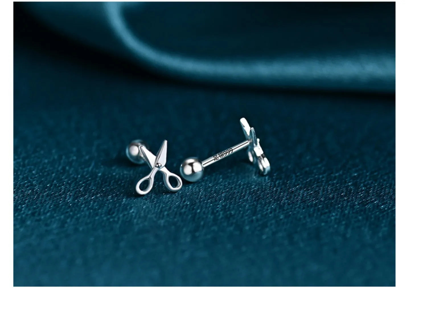 A pair of pure silver ear nails with a miniature scissors screw fastening mechanism.