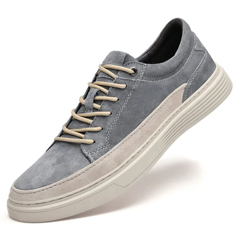 Men's grey low-top casual leather skate shoes with a round toe and flat rubber sole.
