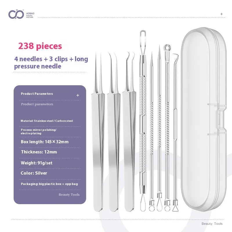 Four silver metal acne needles with fine pointed tips laid out on a surface.