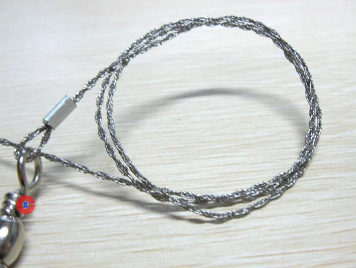 Survival wire saw tool with stainless steel blade and pull rings for outdoor cutting