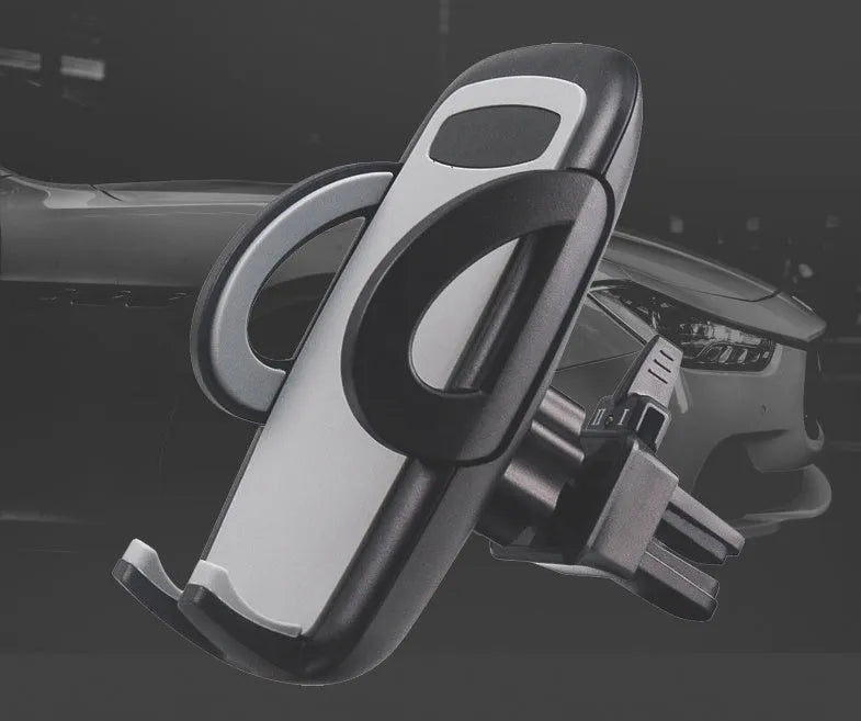 Black car air vent mobile phone holder mounted on vehicle air conditioning outlet holding smartphone