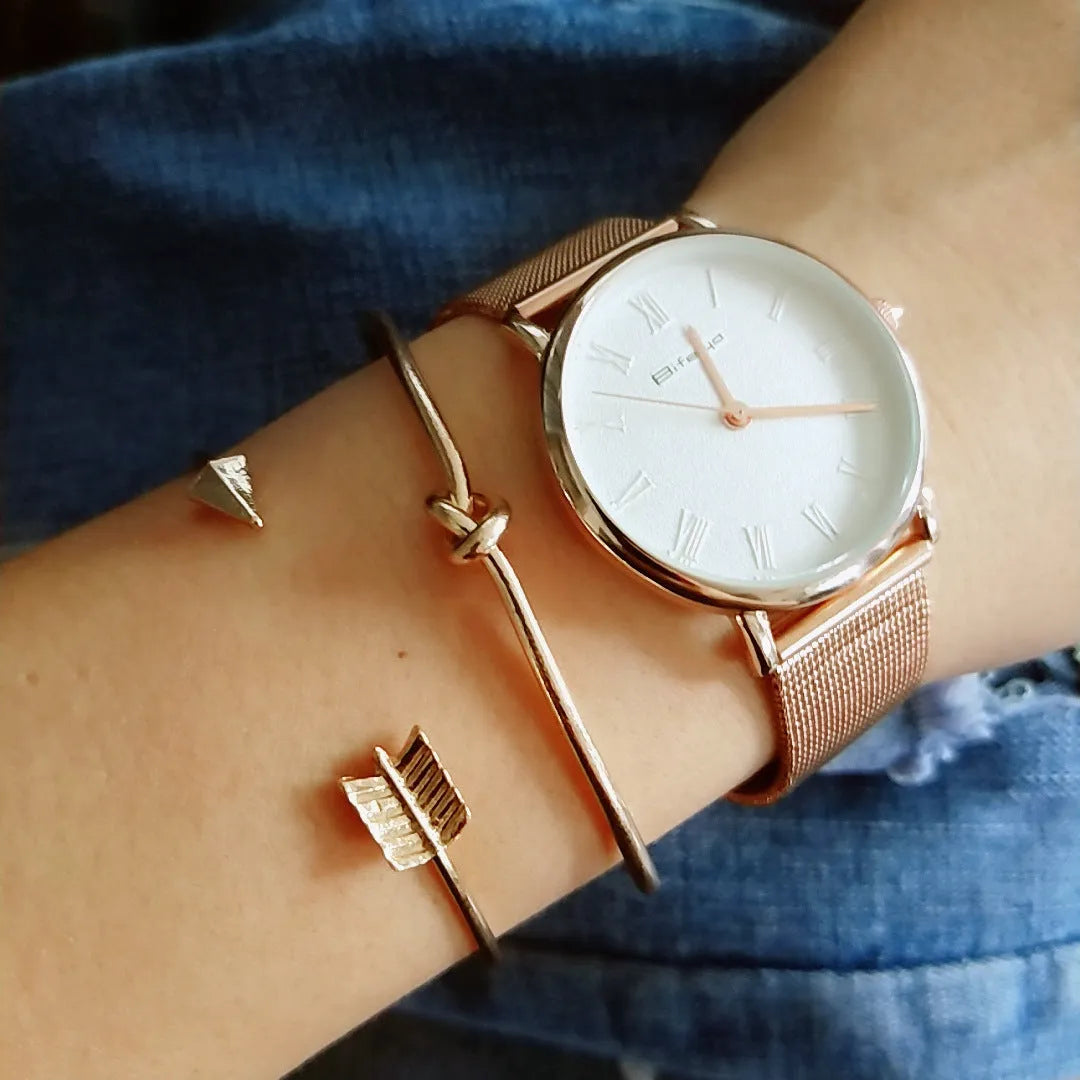 Gold vintage cuff bracelet for women with an arrow and knotted design detail.