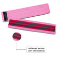 Set of three fabric resistance bands in lake blue, pink, and purple with a net storage bag.