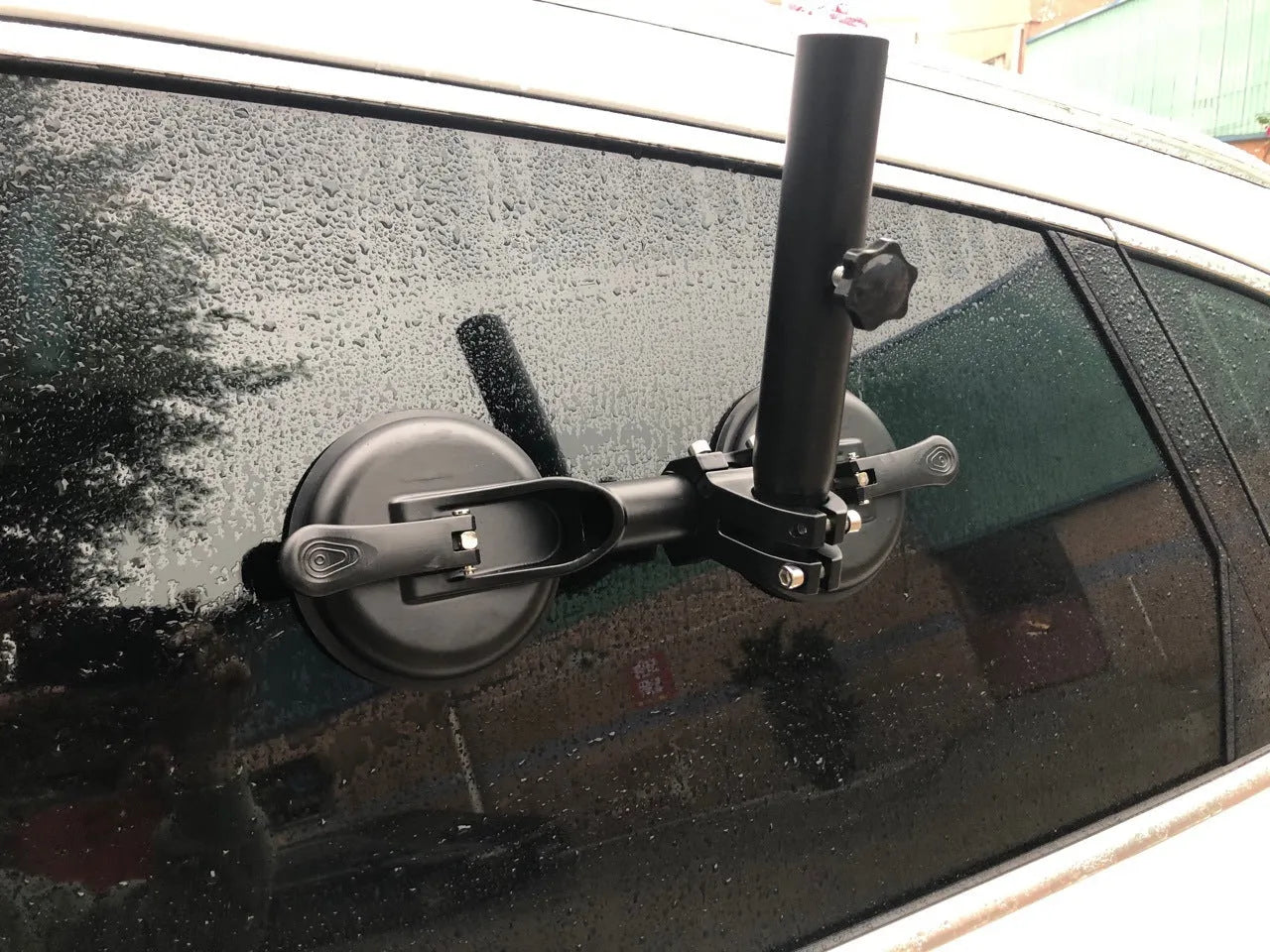 Black car sucker base with round suction cup for off-road flagpole mounting on vehicle windscreen