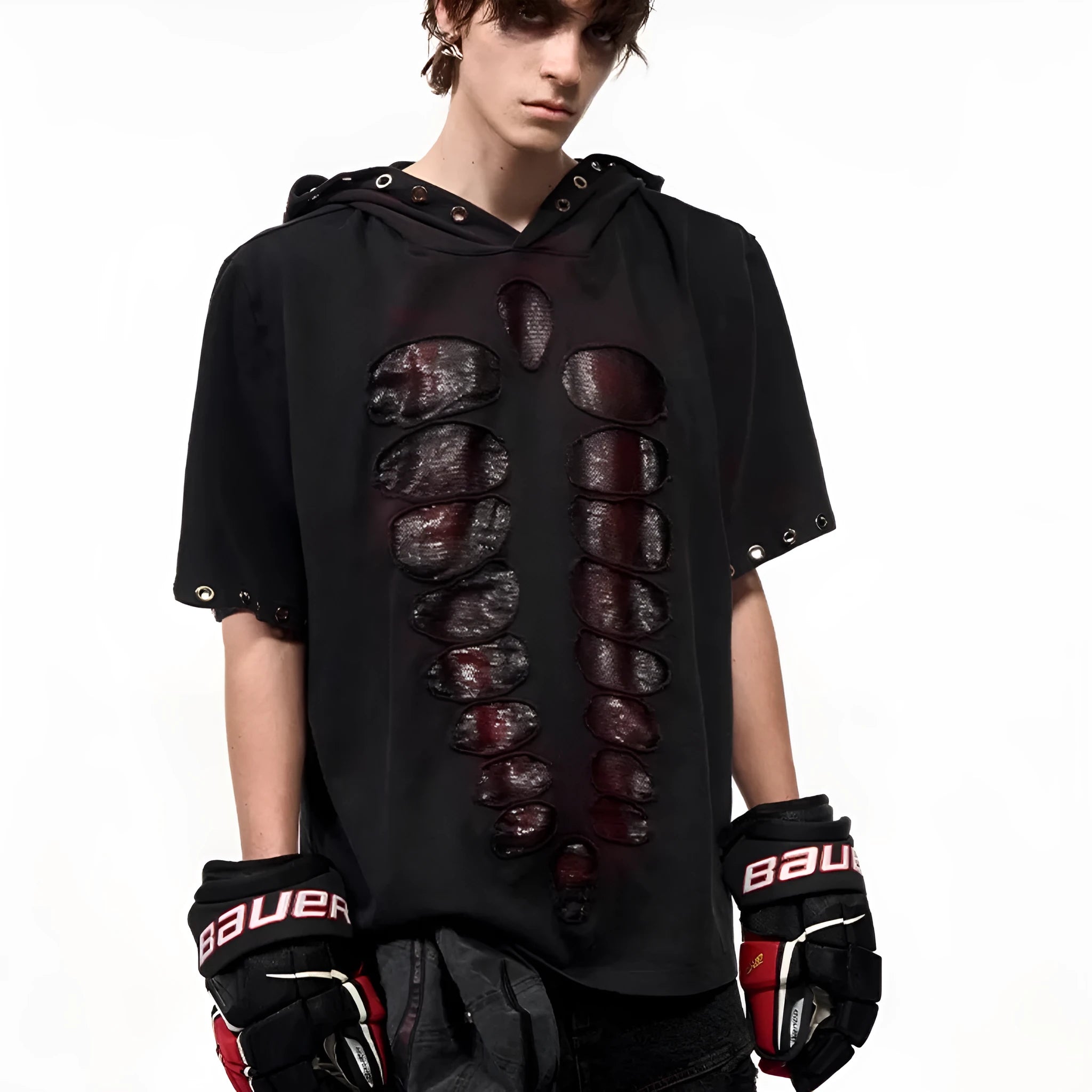 Man wearing a black hooded T-shirt covered in sequins, showing loose fit and short sleeves.