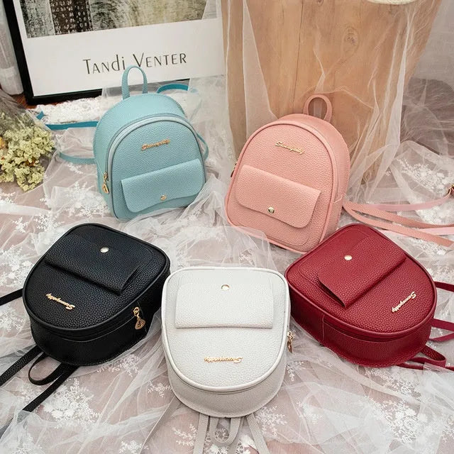 Women's small PU shoulder backpack 18.5cm length in black, blue, grey, pink, or red with zipper closure