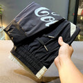 Black men's casual cropped trousers with ankle band made from ultra-thin ice silk and cotton.