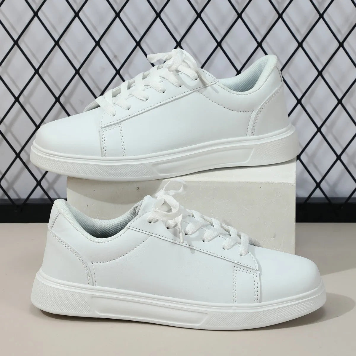 Beige brown platform casual sneaker with cross-belt detail and a low-top silhouette on a white background.