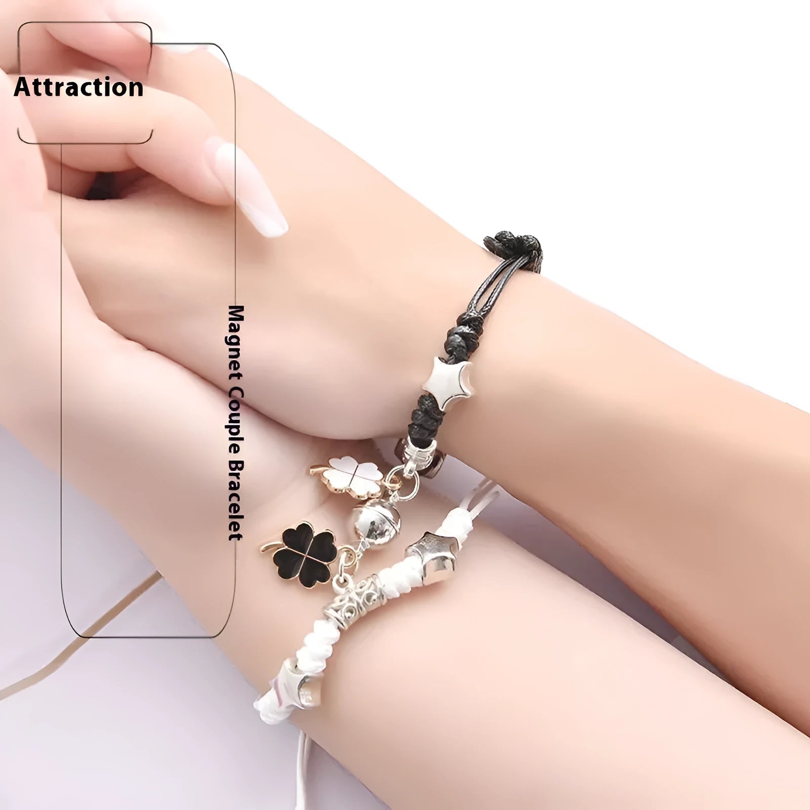 A pair of silver alloy bracelets with magnetic clasps and assorted charm designs including crowns, stars, and clovers.