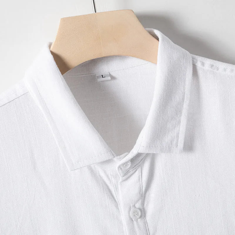 A man's loose-fit linen T-shirt with a lapel collar and short sleeves, shown in a hemp blend fabric.