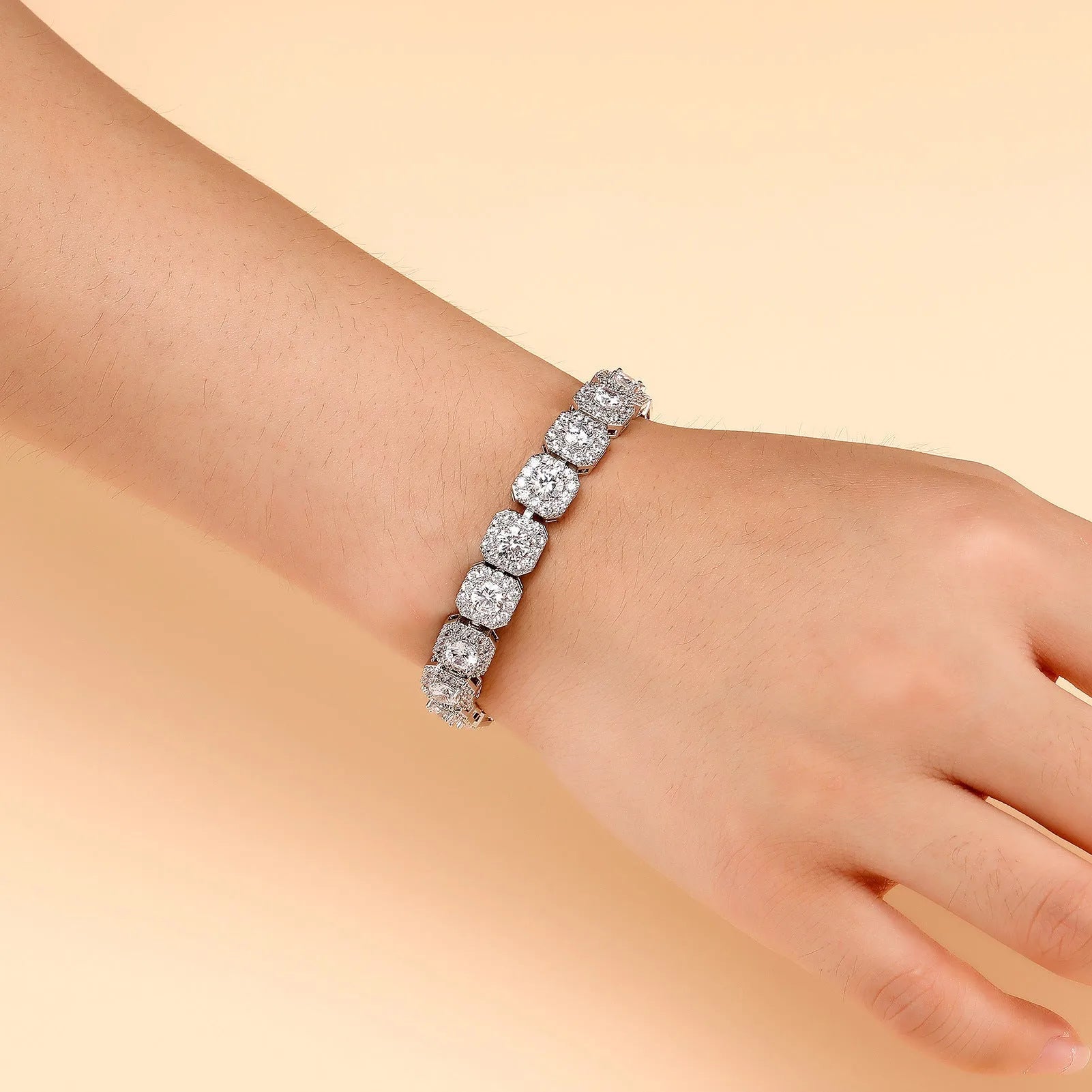 Men's silver zircon flip Cuban chain bracelet on wrist showing inlaid zircon and clasp detail