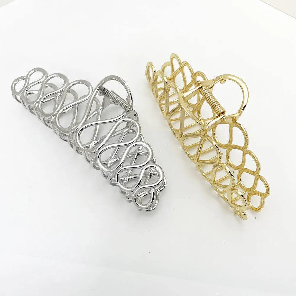 Updo minimalist large hair clip in gold, alloy with electroplated finish and tassel detail