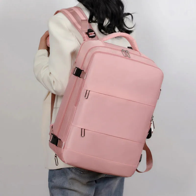 Large capacity purple travel backpack for women with laptop compartment and multiple organisational pockets