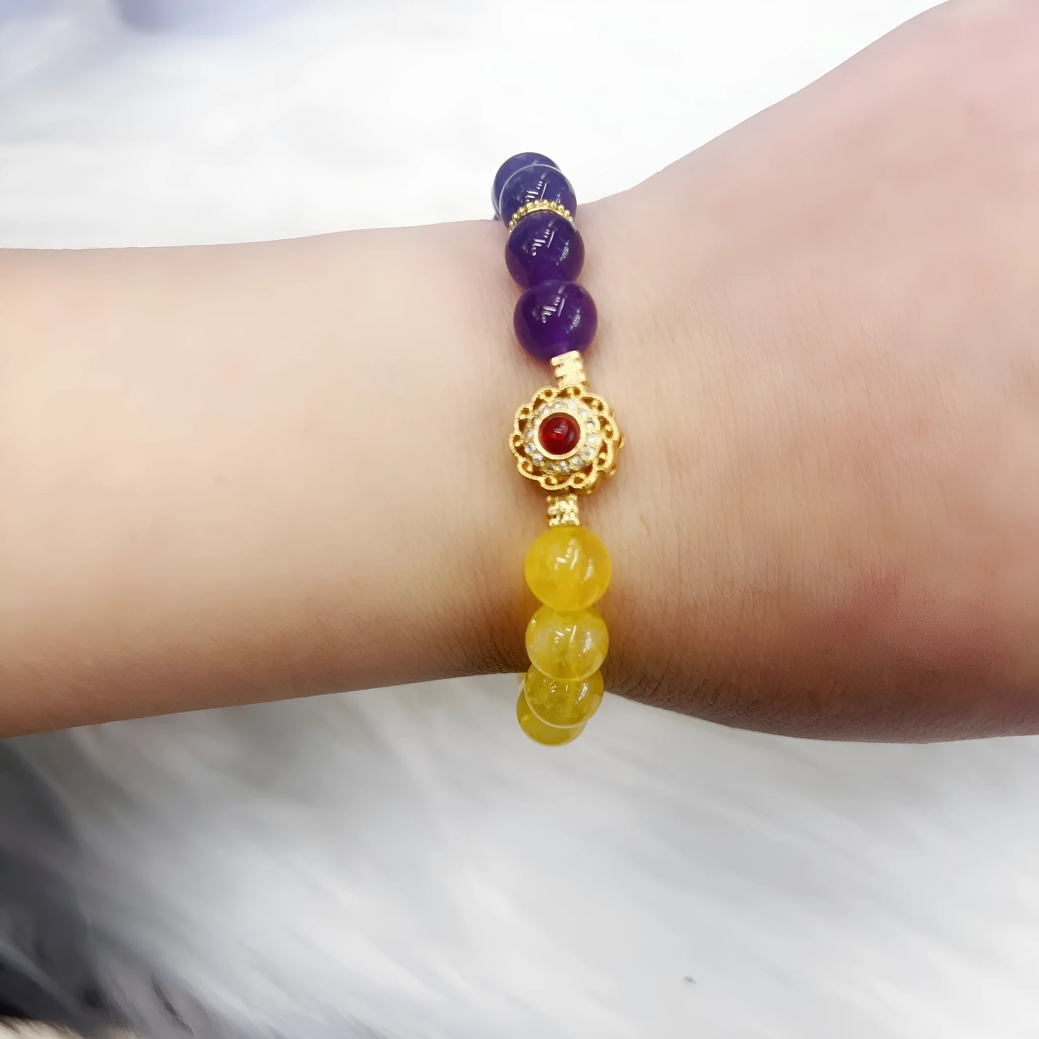 Handmade yellow and purple crystal amethyst bracelet for women showing artisan craftsmanship