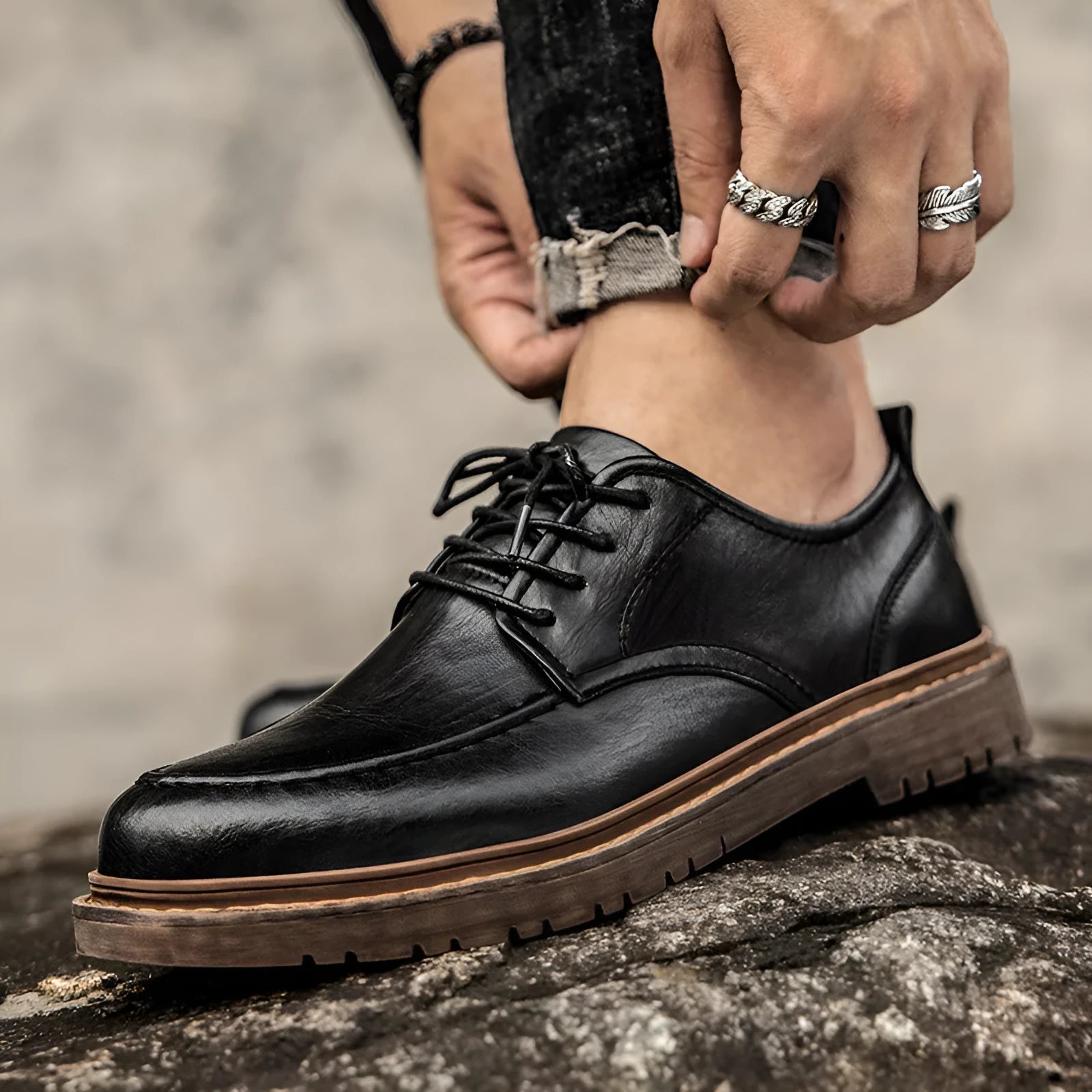 Men's tooling casual leather shoes in black, round toe low top with stitching details on rubber sole