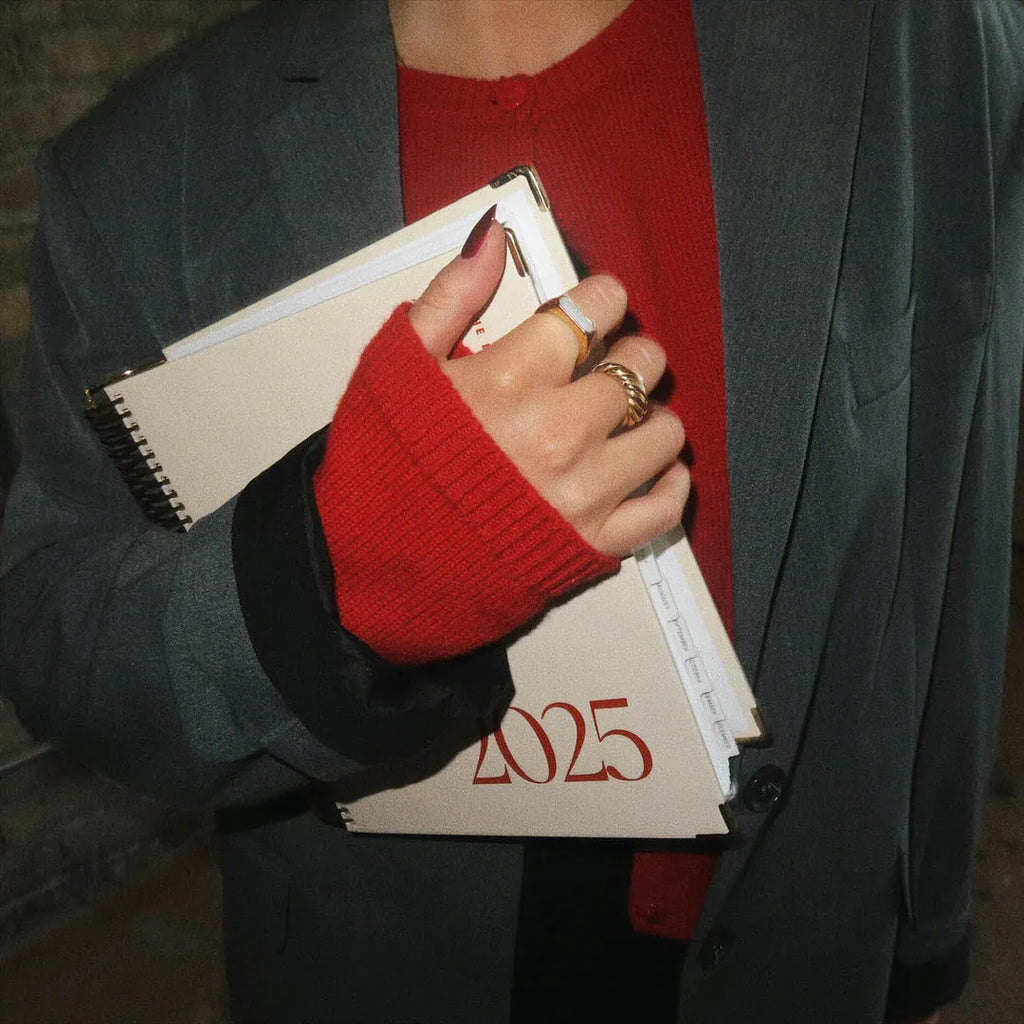 Cherry red A5 coil notebook with wire-bound spine for daily scheduling