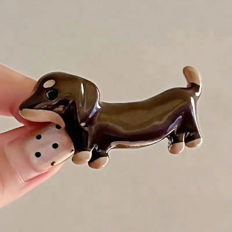 Cute dachshund dog barrettes with electroplated finish on light background