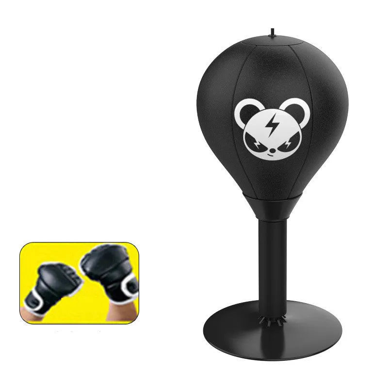 Tabletop boxing speed ball with black PU leather inflatable ball on desk using suction cup base for reflex training and stress relief.