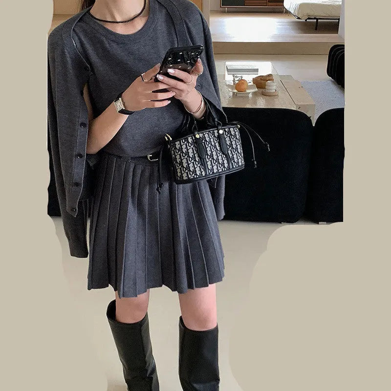 Women's grey knitted vest skirt and cardigan two-piece set with pleated design and belt