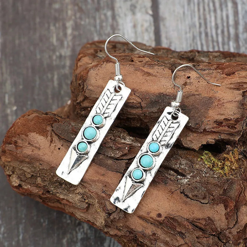 Silver geometric earrings with turquoise inlay on long strip zinc alloy retro design